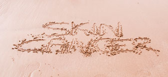 Hautkrebs Behandlung in Wien SKIN CANCER in den Sand geschrieben